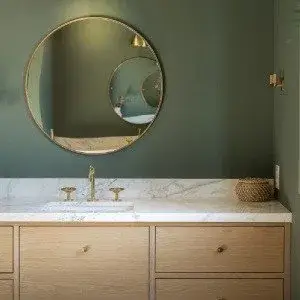 Jade green bathroom with natural wood