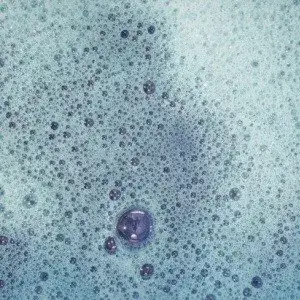 Closeup of Dish Soap Liquid Bubbles after cleaning kitchen cabinets