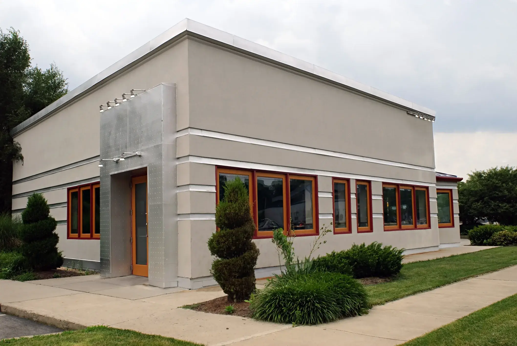 A small gray business building, commercial exterior painting