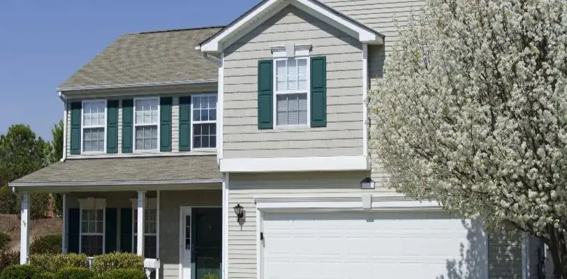 Exterior House Painting Tips - Kimberly Painting - Marietta, GA - Gray two story with green shutters white trim doors