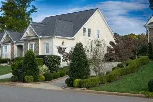 Exterior Painting Tips - Kimberly Painting - Sandy Springs, GA - Yellow house with brick white trim