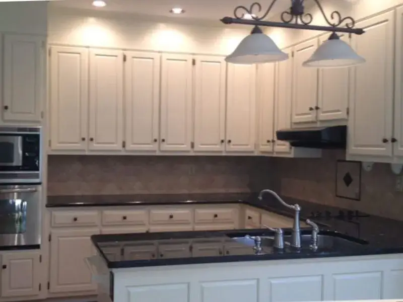 Dark oak cabinets painted white, after