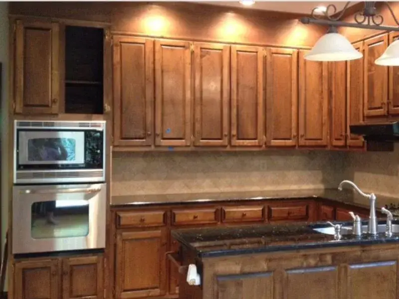Dark oak cabinets painted white, before