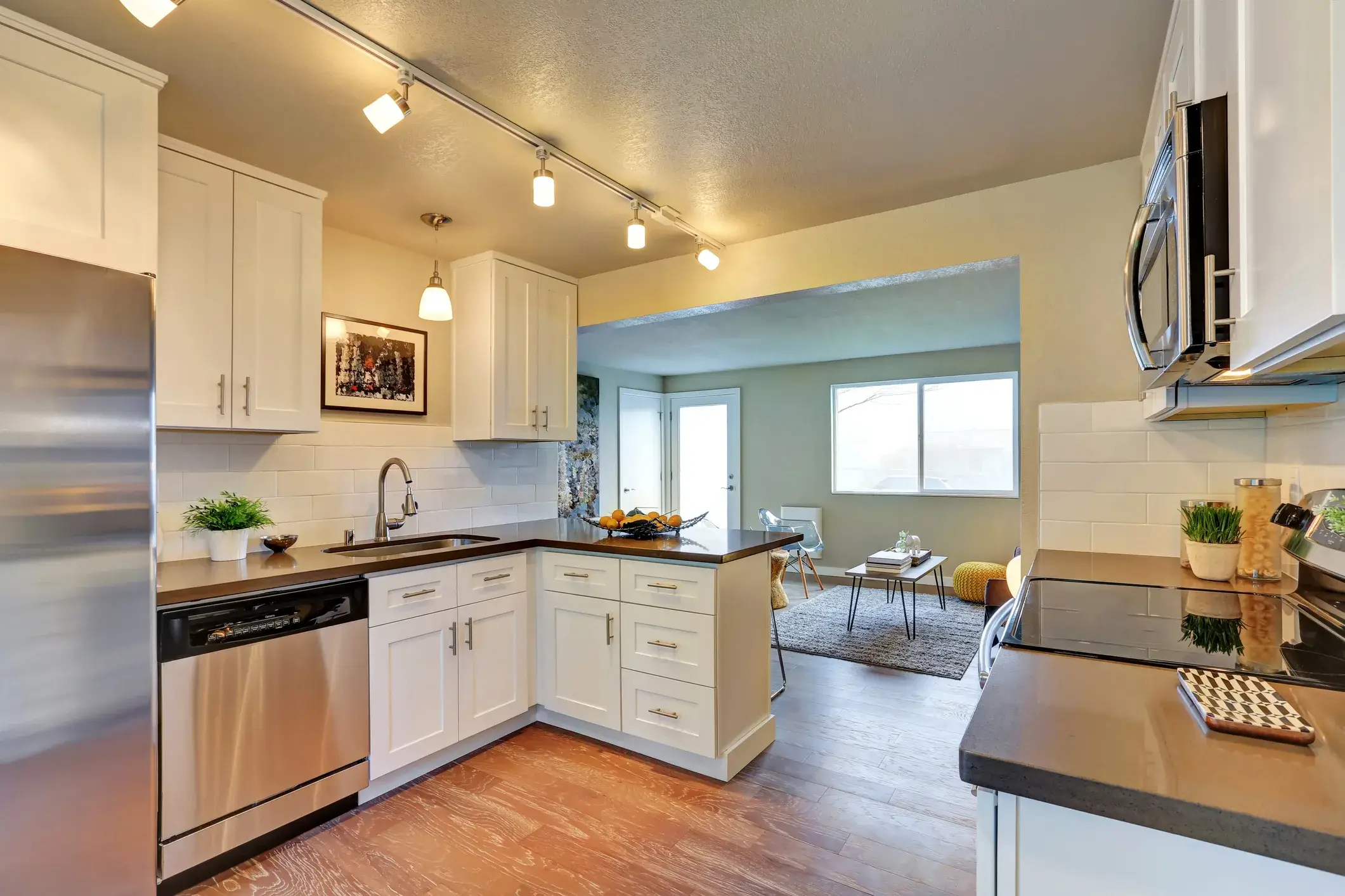White kitchen cabinets with blue painted walls