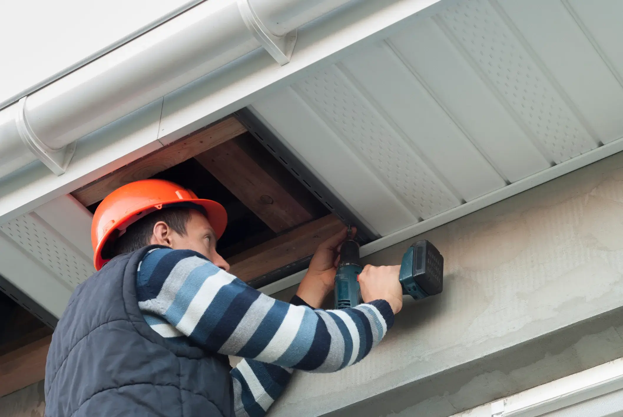 Installing a new soffit during repair, by Kimberly Painting