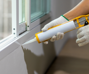 Caulking Window Before Interior Painting Job