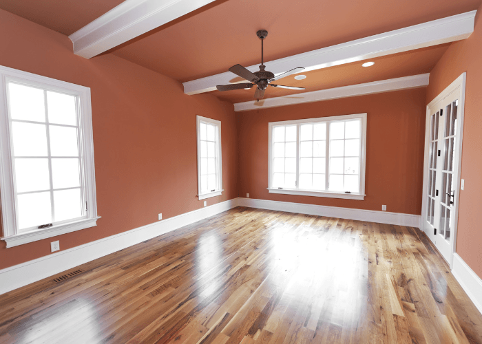 Bright, colorful bedroom with wood floors in GA